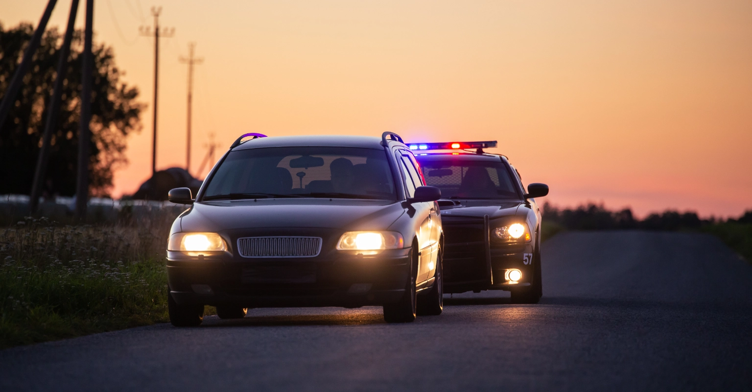 Patrol vehicle positioned behind a car during a traffic stop